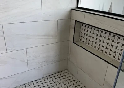 Completed bathroom renovation by My Home Handyman in Calgary, Alberta. Detail of tile work in shower.