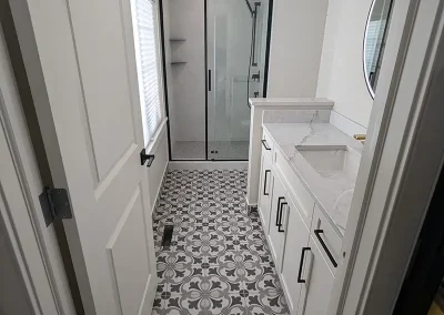 Completed bathroom renovation by My Home Handyman in Calgary, Alberta. Featuring modern fixtures, stylish tile work, and updated vanities and shower.