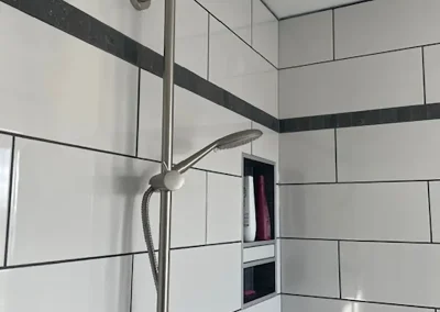 Detail of Completed bathroom renovation by My Home Handyman in Calgary, Alberta. Featuring modern fixtures, stylish tile work, and shower.