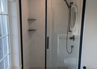 Completed bathroom renovation by My Home Handyman in Calgary, Alberta. Featuring modern fixtures, stylish tile work and shower.